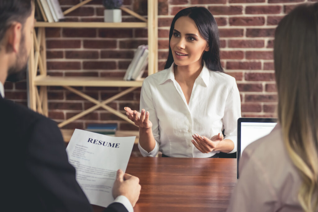 woman interviewing for job with two people